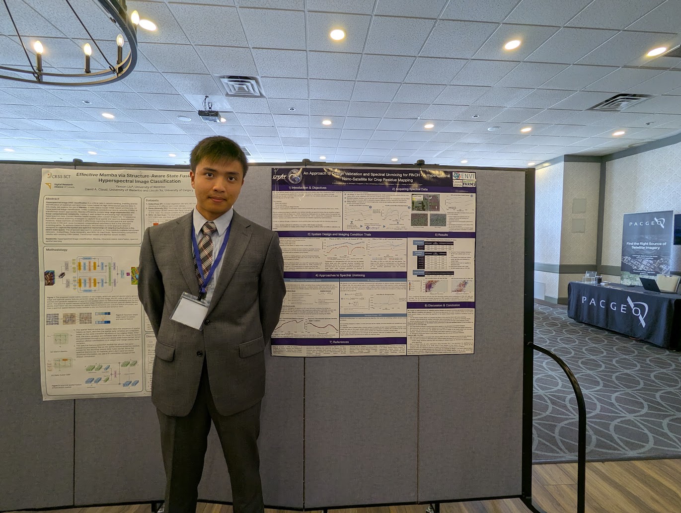 Standing beside the project poster